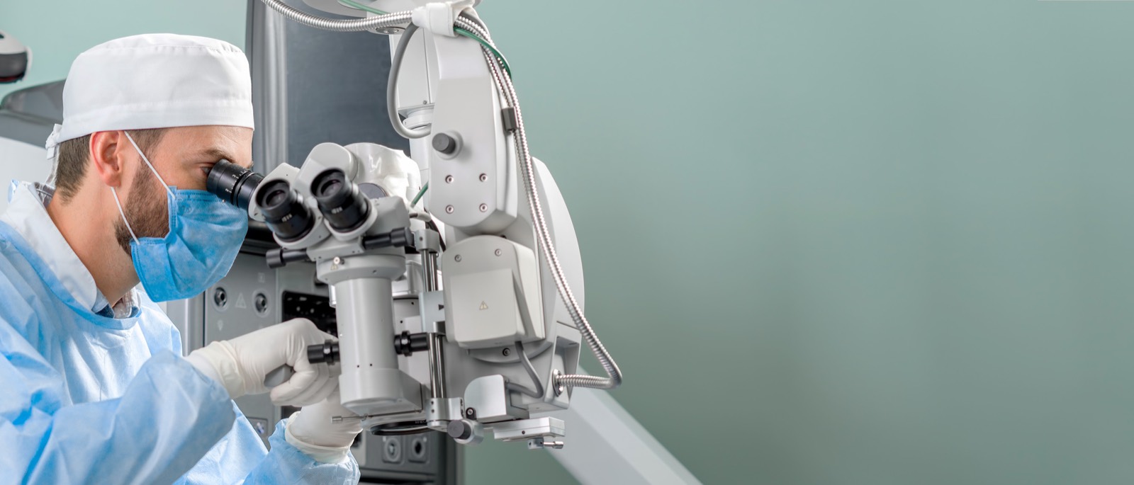 Surgeon at an operating microscope